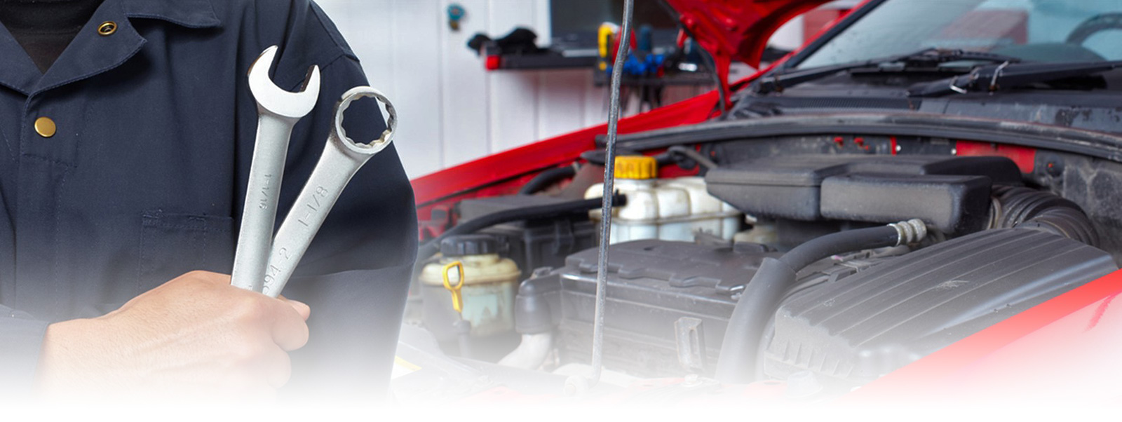 Mechanic holding a wrench with a opened hood red car behind his back